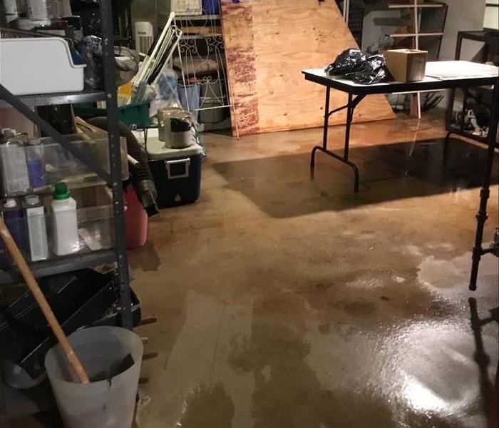 unfinished basement floor wet with a water